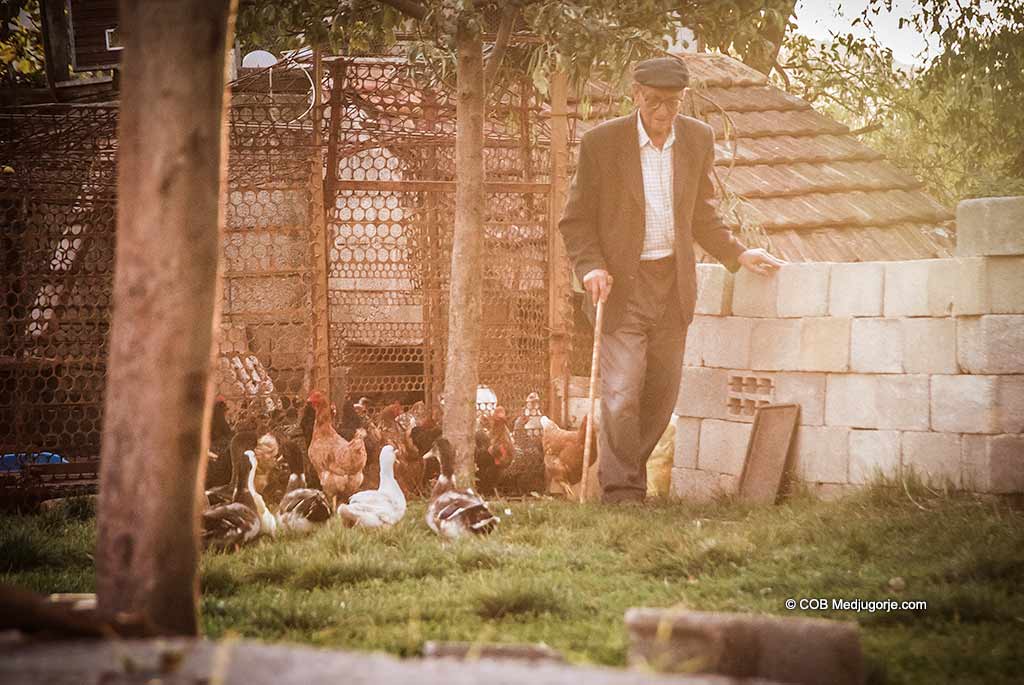 Medjugorje villager with chickens