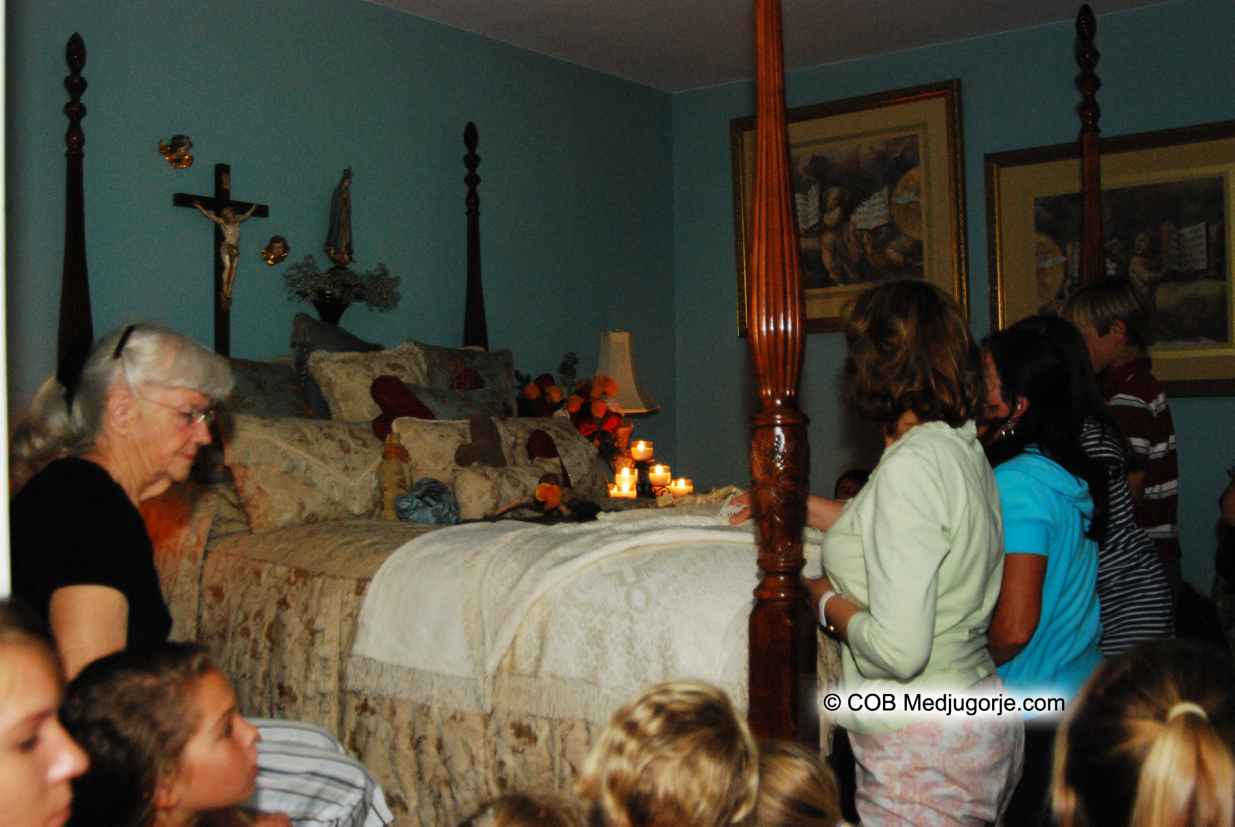 community praying in the bedroom