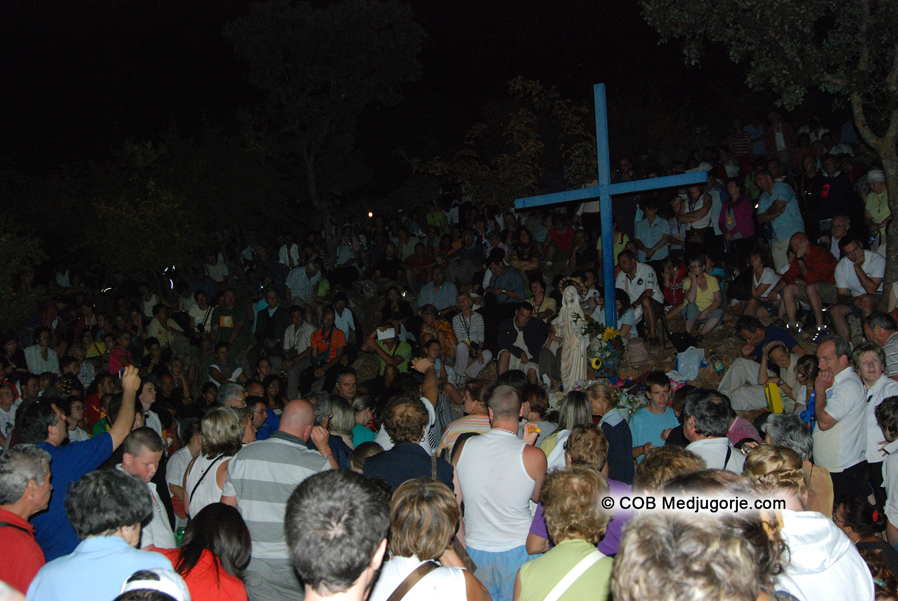 Pilgrims at Blue Cross on Apparition Mountain Medjugorje