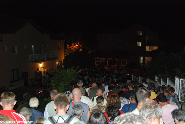 Pilgrims leaving Blue Cross on Apparition Mountain Medjugorje after apparition