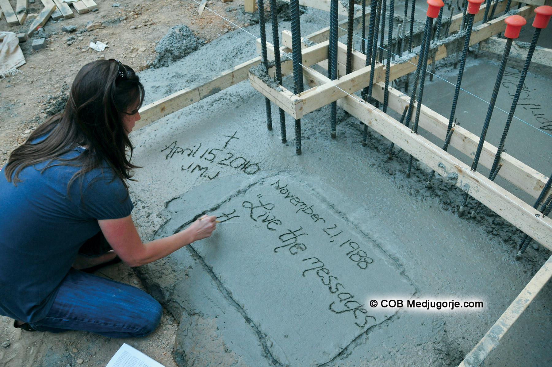 community member writing message in concrete