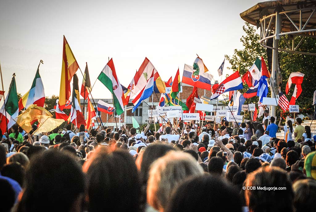 Pilgrims with flags in Medjugorje