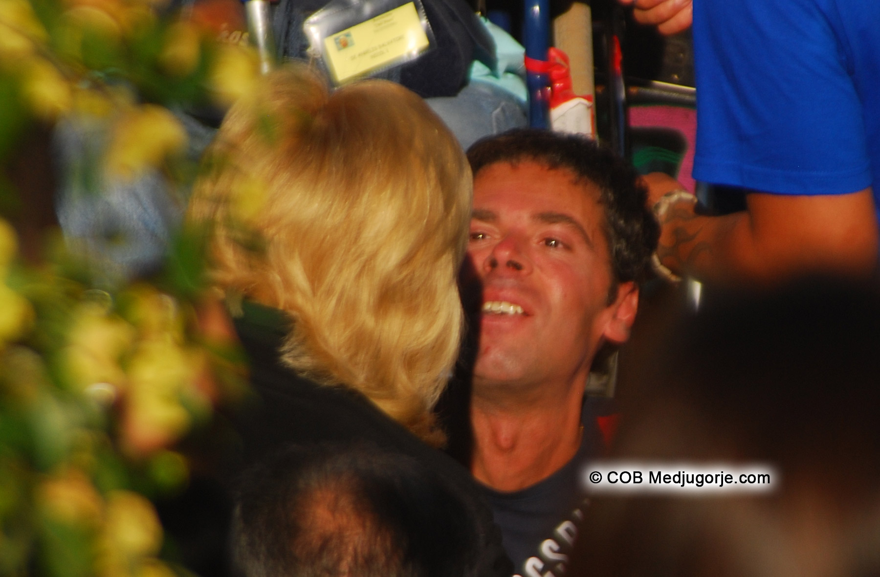 Medjugorje visionary Mijana greets a crippled man before Her Apparition