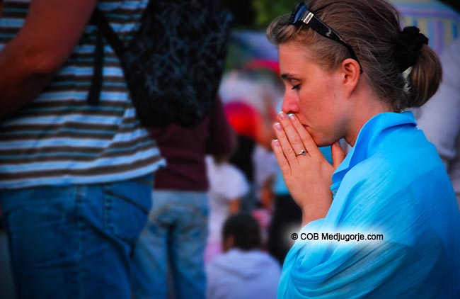 Pilgrim praying in Medjugorje
