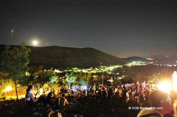 pilgrims at Medjugorje visionary Ivan's apparition on Apparition Mountain