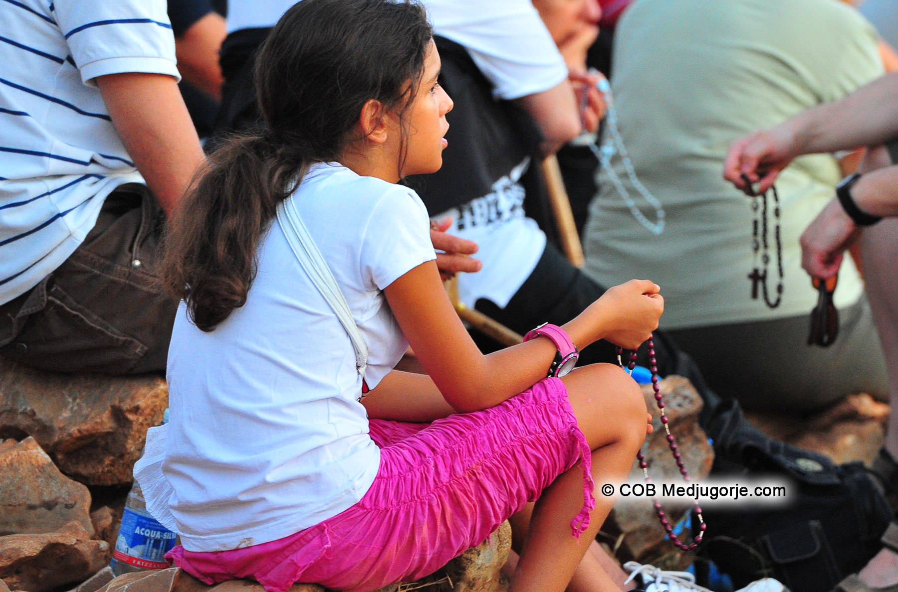 Young girl in Medjugorje praying August 24, 2012
