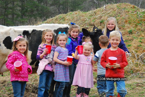 Caritas Community Kids with Milk