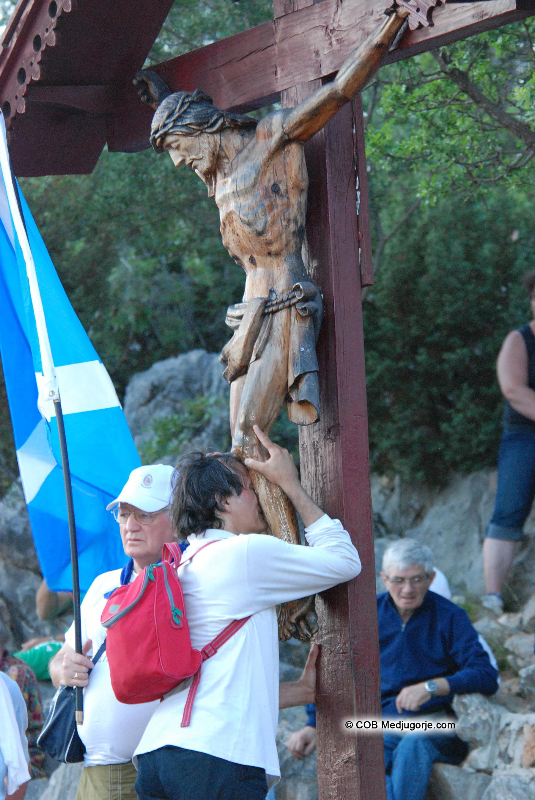 Pilgrim praying on Apparition Mountain June 24, 2013