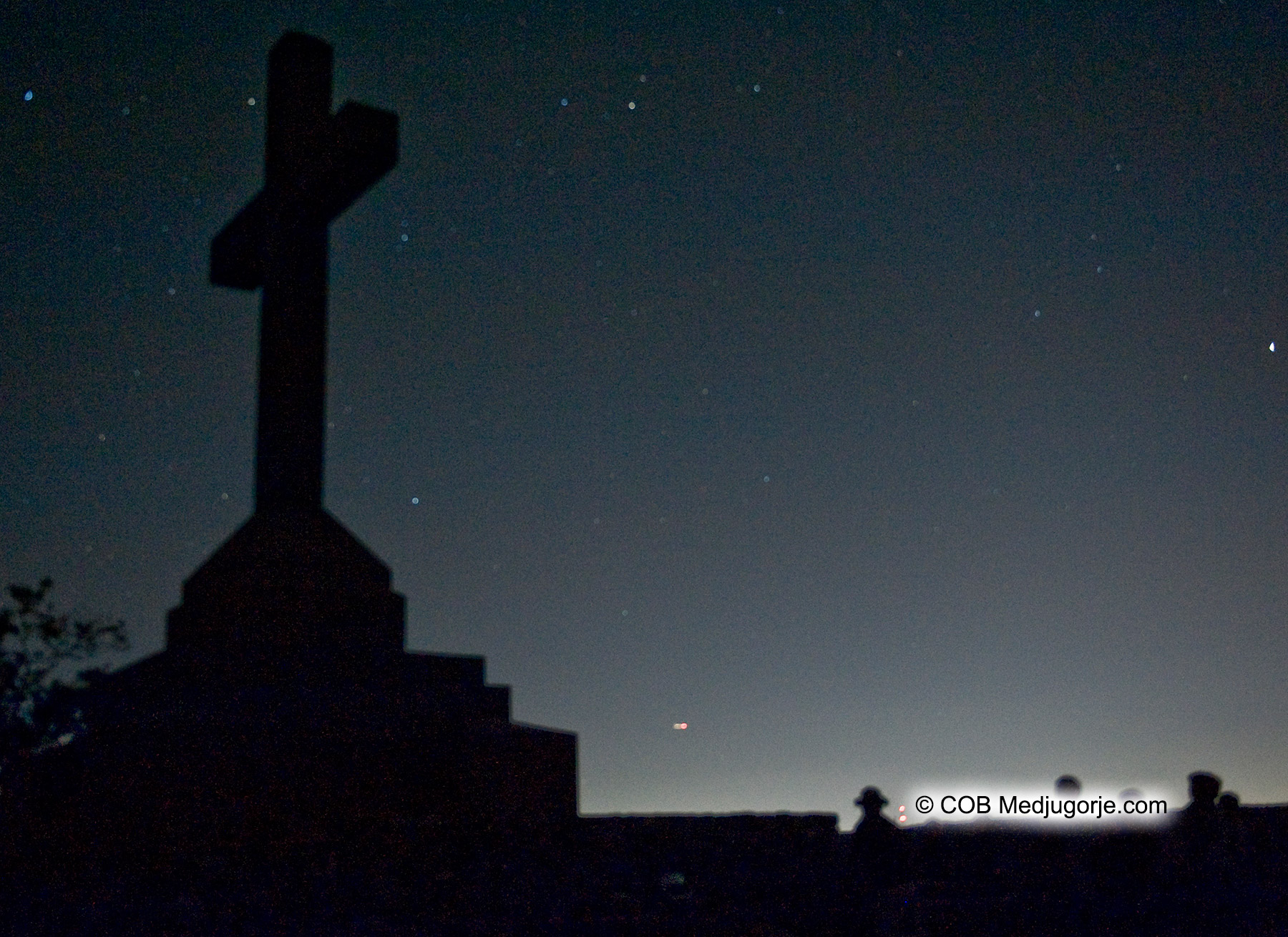 Caritas Community and the Cross at Night
