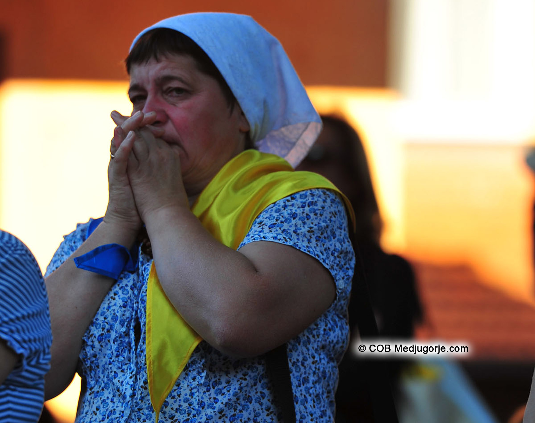 Pilgrim praying at Mirjana's apparition of Our Lady July 2, 2014