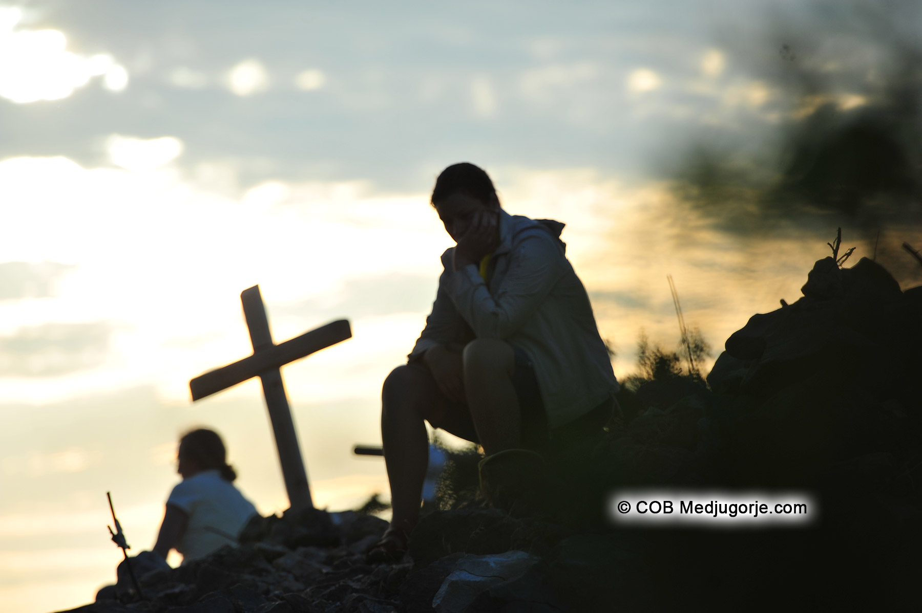 Pilgrim praying on Cross Mountiain in Medjugorje
