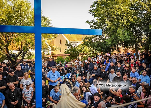 Pilgrims at the Blue Cross