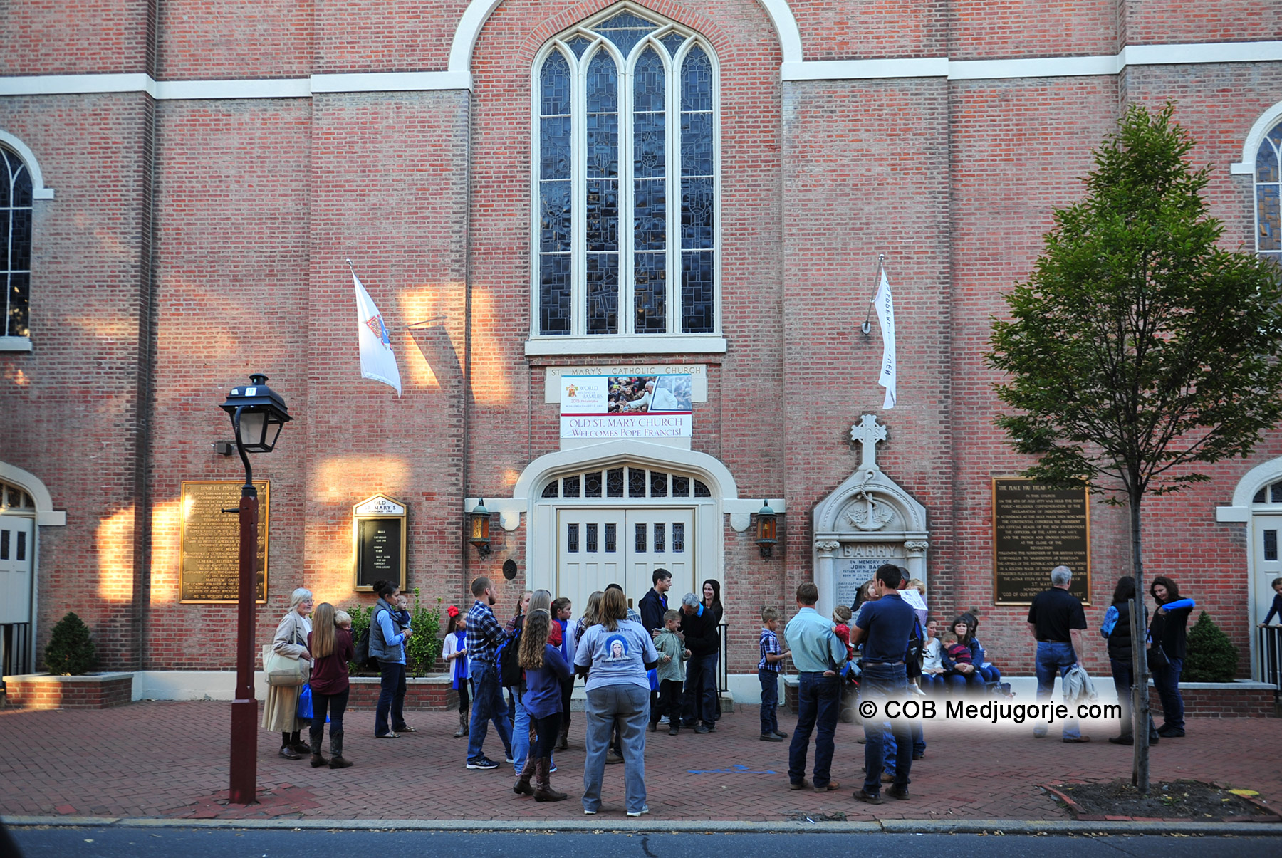 pilgrims and community outside St. Mary's Church in Philedelphia