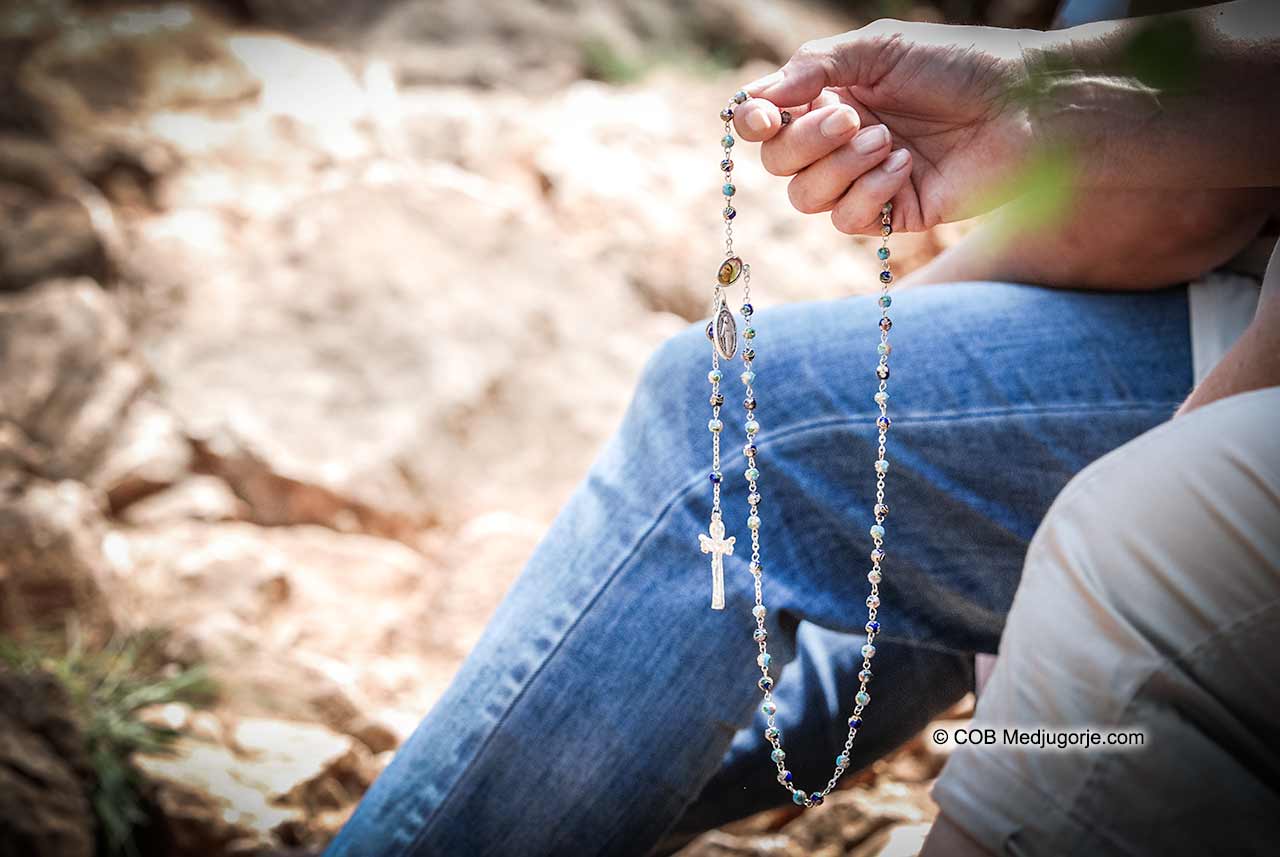 Medjugorje Pilgrim Praying Rosary