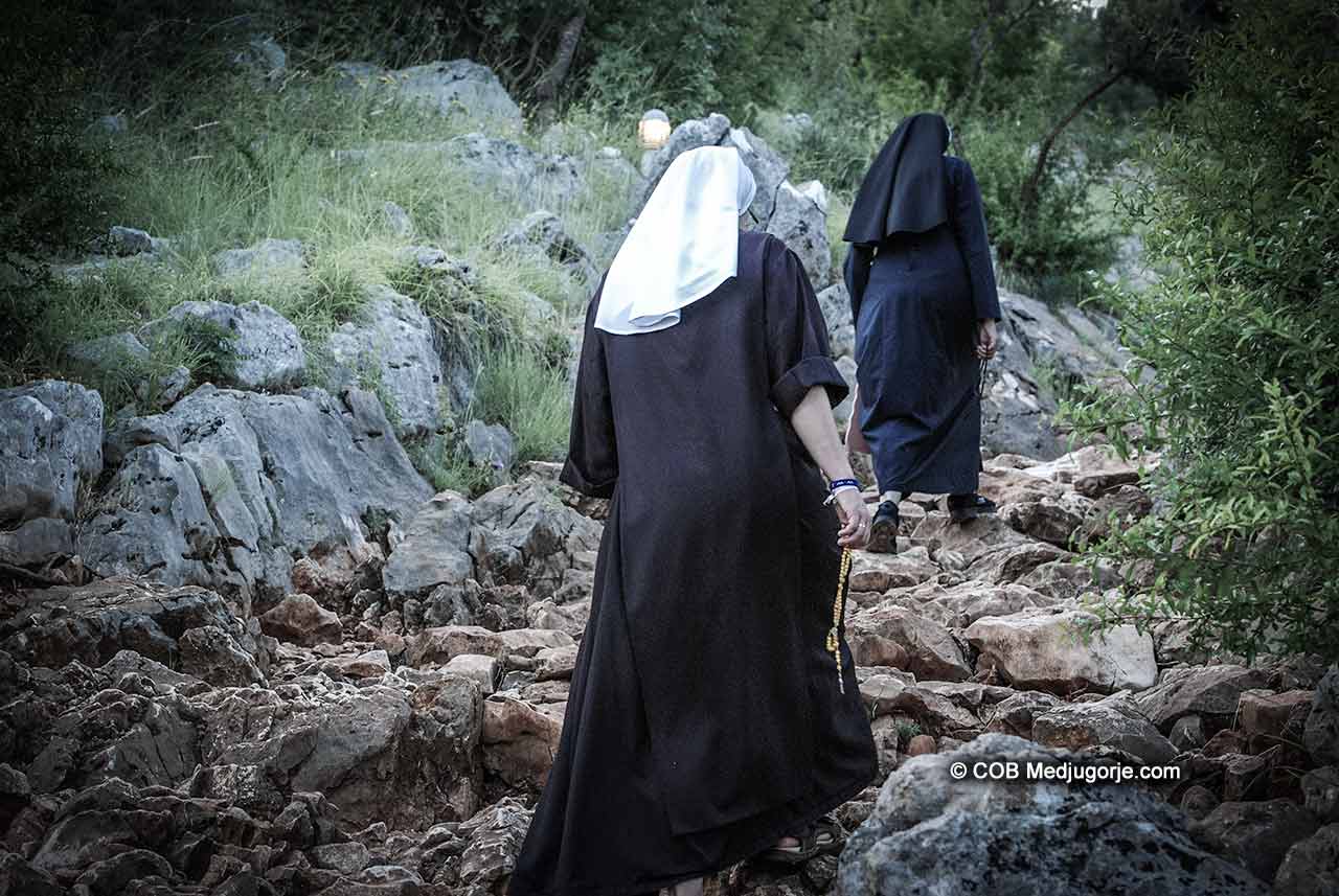 Nuns climbing Cross mountain in Medjugorje