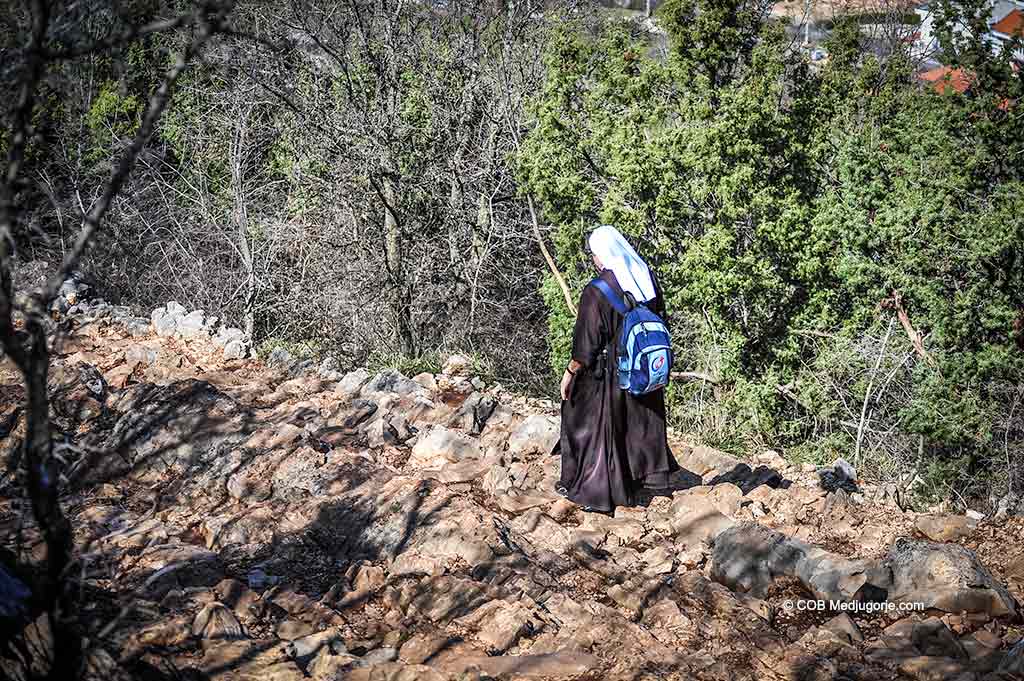 A nun climbs Cross Mountain in Medjugorje