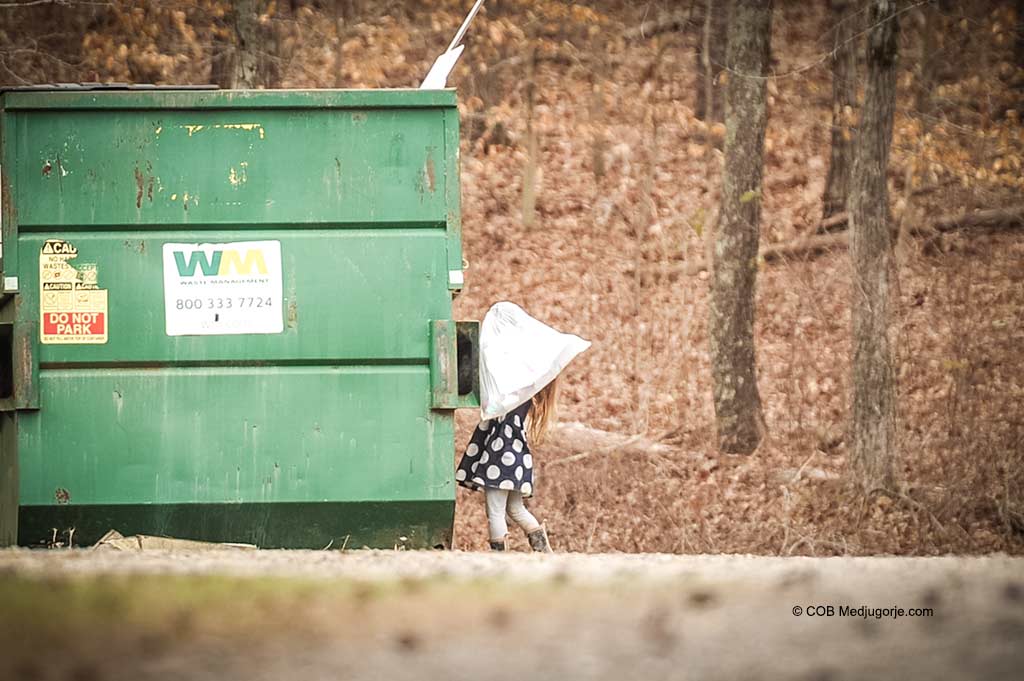 Polly Kate carrying garbage.