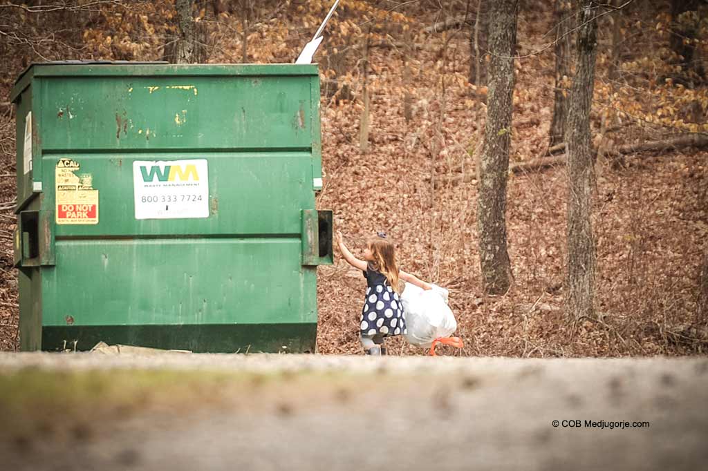 Polly Kate carrying garbage.