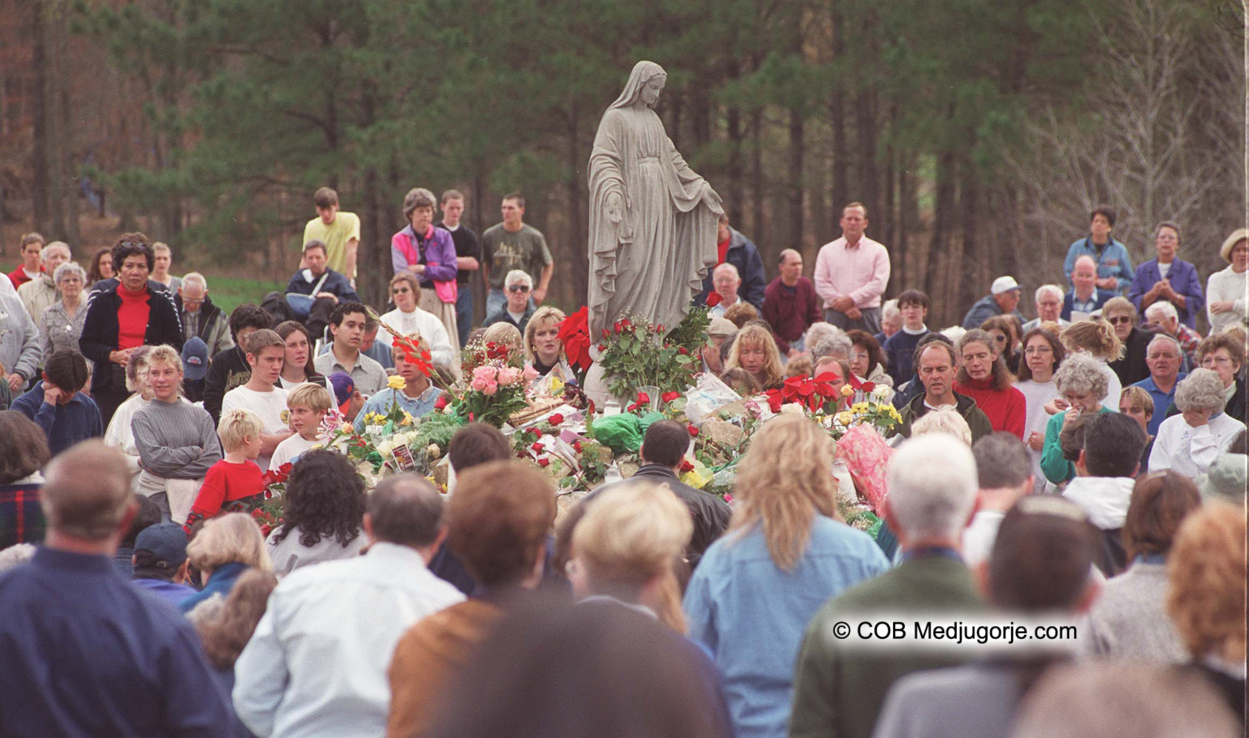 pilgrims praying in the field of apparitions