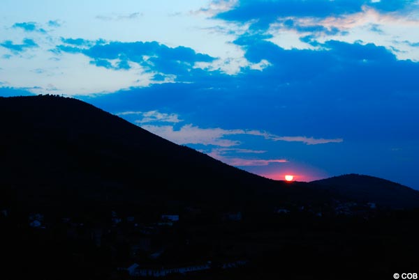 The sun setting in the distance over Cross Mountain, September 11, 2009