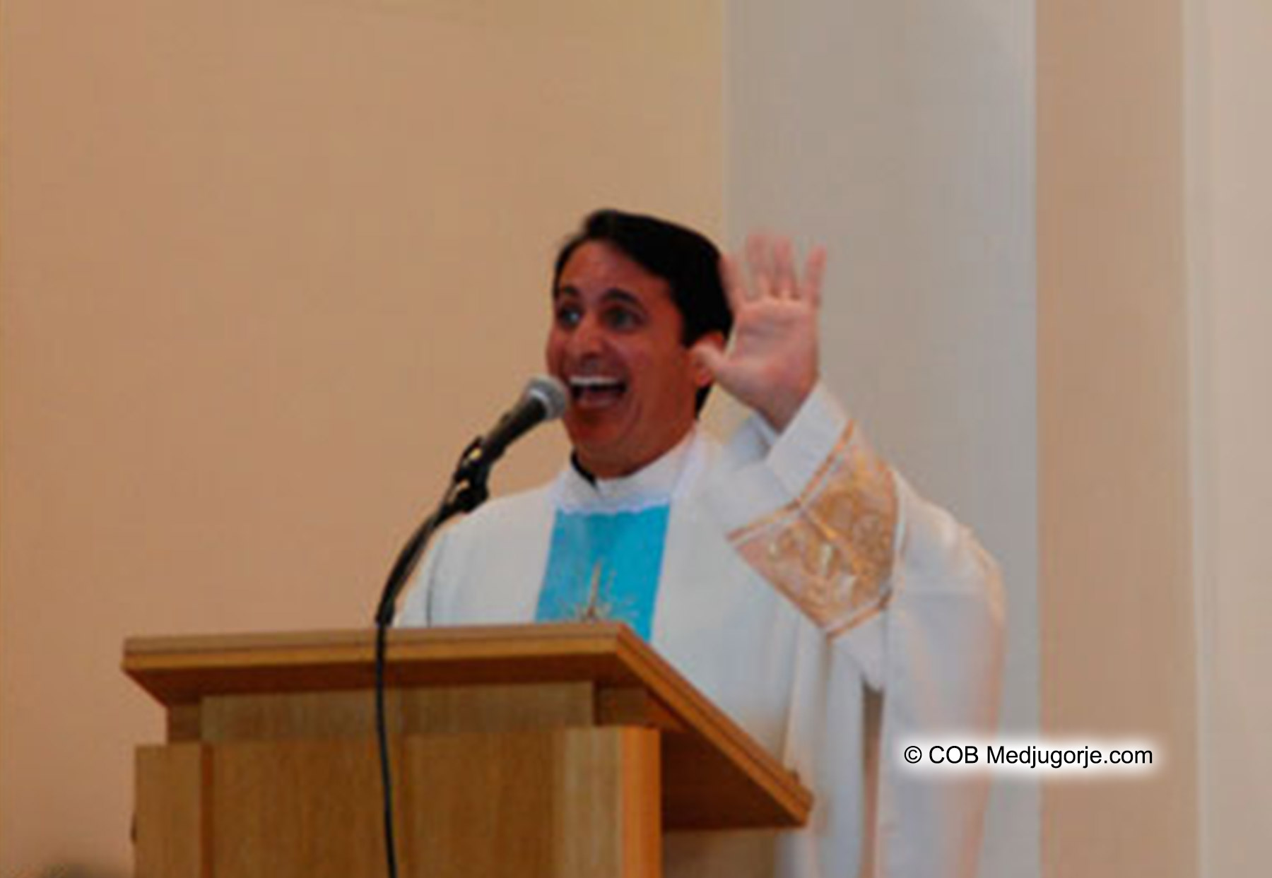 Fr. Charles Mangano exciting laughter at the pulpit of St. James Church in Medjugorje